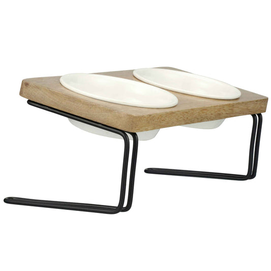 Elevated and angled feeder with ceramic bowls side view on a white background.
