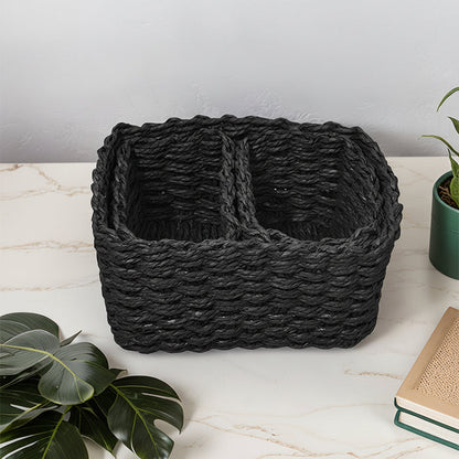 Black rectangular woven storage basket with two divided compartments displayed on a countertop