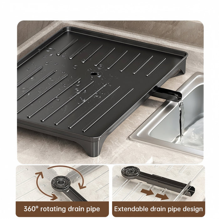 Black dish rack drainboard with an extendable 360-degree rotating drain spout directing water into a sink