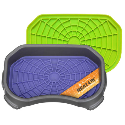 The purple Neat-Lik Mat inside the grey tray, with a green mat behind it on a white background.