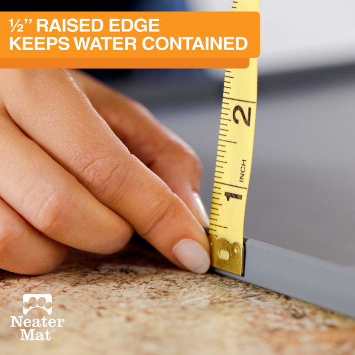 The Neater Mat has a 1/2 inch raised edge which keeps water and food spills contained.