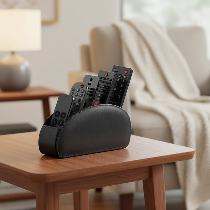 Black remote control organizer holding multiple TV and streaming remotes on a white background