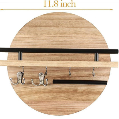 Light brown round wooden wall shelf with metal rails and hooks measuring 11.8 inches wide